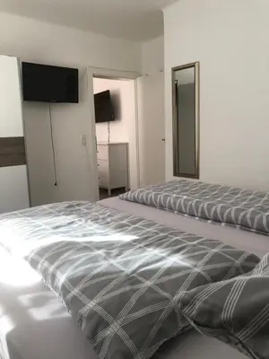 Ein Bett oder Betten in einem Zimmer der Unterkunft Ferienwohnung Top 3
