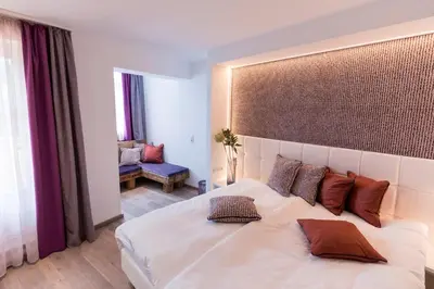 Ein Bett oder Betten in einem Zimmer der Unterkunft Hotel Flachauerhof