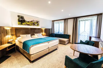 Ein Bett oder Betten in einem Zimmer der Unterkunft Alpenhotel Wurzer