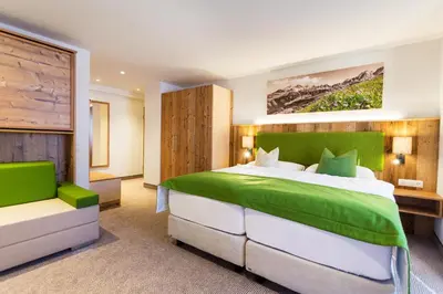Ein Bett oder Betten in einem Zimmer der Unterkunft Alpenhotel Wurzer