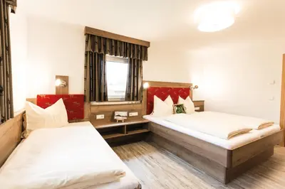 Ein Bett oder Betten in einem Zimmer der Unterkunft Pension Schönberger