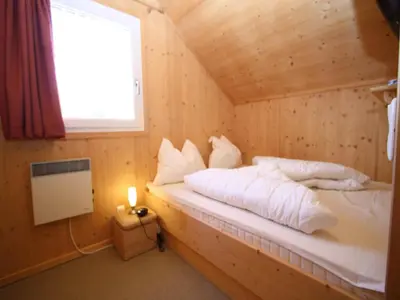 Ein Bett oder Betten in einem Zimmer der Unterkunft Holzchalet nahe Skilift Hohentauern