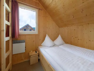 Ein Bett oder Betten in einem Zimmer der Unterkunft Holzchalet nahe Skilift Hohentauern