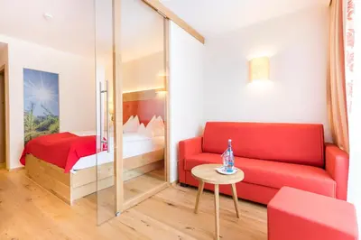Ein Bett oder Betten in einem Zimmer der Unterkunft Hotel Alpenland