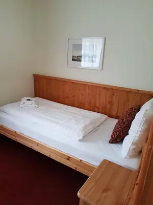 Ein Bett oder Betten in einem Zimmer der Unterkunft Hotel Tauplitzerhof