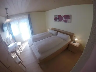 Ein Bett oder Betten in einem Zimmer der Unterkunft Ferienwohnung Schönauer