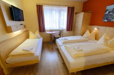 Ein Bett oder Betten in einem Zimmer der Unterkunft JUFA Hotel Donnersbachwald