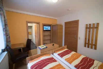 Ein Bett oder Betten in einem Zimmer der Unterkunft Gasthof Staud'nwirt