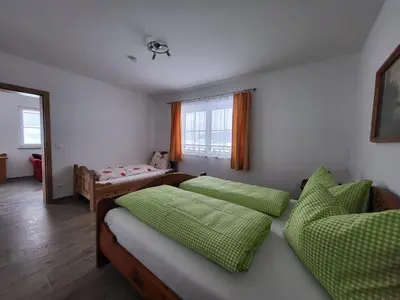 Ein Bett oder Betten in einem Zimmer der Unterkunft Ferienwohnungen Maderebner