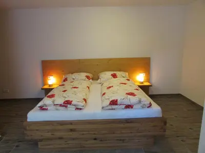 Ein Bett oder Betten in einem Zimmer der Unterkunft Ferienwohnungen Maderebner