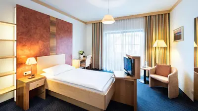 Ein Bett oder Betten in einem Zimmer der Unterkunft Parkhotel zur Klause