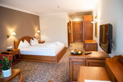 Ein Bett oder Betten in einem Zimmer der Unterkunft Sporthotel Radstadt