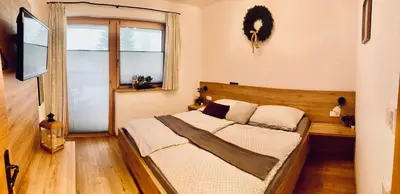 Ein Bett oder Betten in einem Zimmer der Unterkunft Sedlhof Apartment