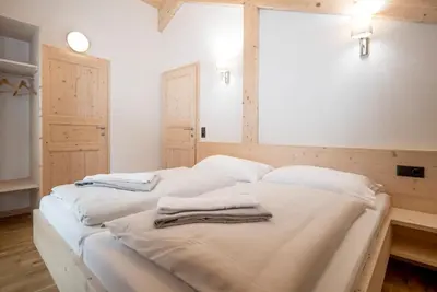 Ein Bett oder Betten in einem Zimmer der Unterkunft Alpenchalets Reiteralm by ALPS RESORTS