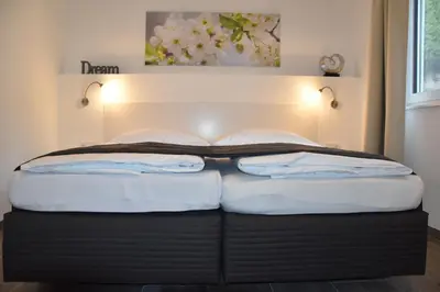 Ein Bett oder Betten in einem Zimmer der Unterkunft Ferienhaus Marianne