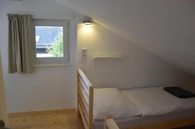 Ein Bett oder Betten in einem Zimmer der Unterkunft Ferienhaus Marianne