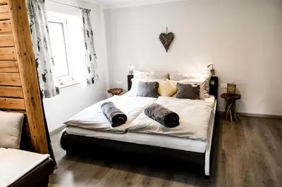Ein Bett oder Betten in einem Zimmer der Unterkunft Ferienhaus Hirschnest