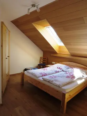 Ein Bett oder Betten in einem Zimmer der Unterkunft Tremlhof