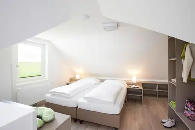 Ein Bett oder Betten in einem Zimmer der Unterkunft Good Rooms GmbH Bad Ischl