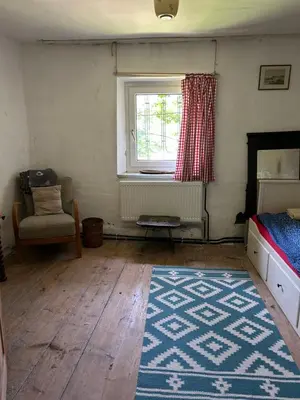 Ein Bett oder Betten in einem Zimmer der Unterkunft Kainzenhof 1690