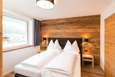 Ein Bett oder Betten in einem Zimmer der Unterkunft APART Forellenhof