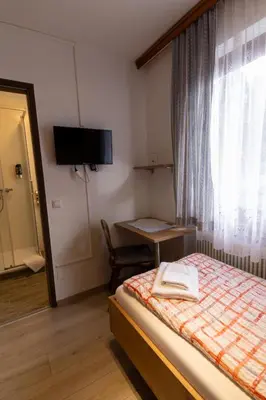 Ein Bett oder Betten in einem Zimmer der Unterkunft Metzgerwirt Vieh Heli