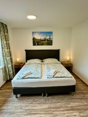 Ein Bett oder Betten in einem Zimmer der Unterkunft Metzgerwirt Vieh Heli