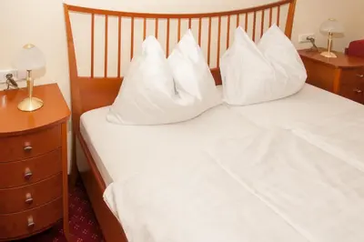 Ein Bett oder Betten in einem Zimmer der Unterkunft Gasthof Hofbauer