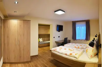 Ein Bett oder Betten in einem Zimmer der Unterkunft Die Reinbachstube