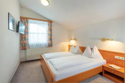 Ein Bett oder Betten in einem Zimmer der Unterkunft Dr. Aufmesser Appartements