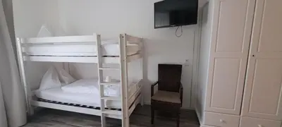 Ein Bett oder Betten in einem Zimmer der Unterkunft Märchenwald Steiermark Gasthof Sonnenhof