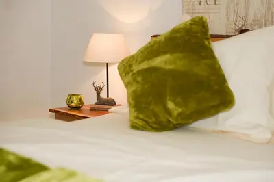 Ein Bett oder Betten in einem Zimmer der Unterkunft Ferienwohnung Alpenblick