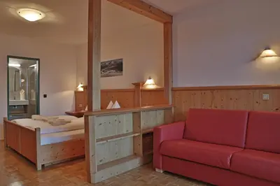 Ein Bett oder Betten in einem Zimmer der Unterkunft Aparthotel Paradies - Schrempfgut