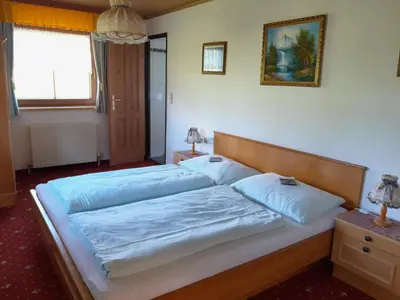 Ein Bett oder Betten in einem Zimmer der Unterkunft Alpenblick