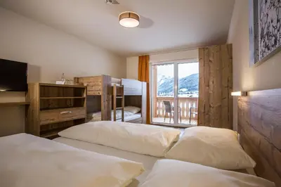Ein Bett oder Betten in einem Zimmer der Unterkunft COOEE alpin Hotel Dachstein