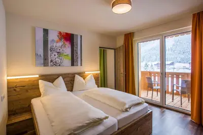 Ein Bett oder Betten in einem Zimmer der Unterkunft COOEE alpin Hotel Dachstein