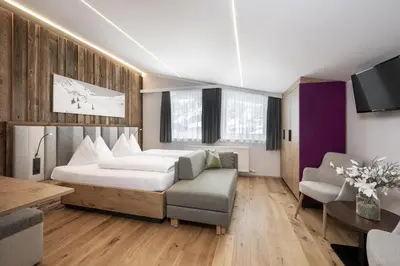 Ein Bett oder Betten in einem Zimmer der Unterkunft Austria Alpinhotel Ski IN Ski OUT an der Edelweissbahn