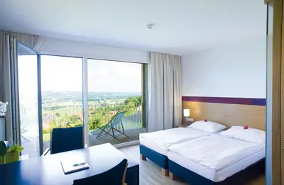 Ein Bett oder Betten in einem Zimmer der Unterkunft SPES Hotel & Seminare