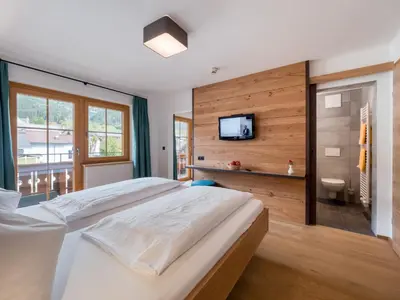 Ein Bett oder Betten in einem Zimmer der Unterkunft Hotel Matschner