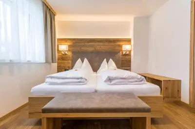 Ein Bett oder Betten in einem Zimmer der Unterkunft OFENTÜRL alpine living