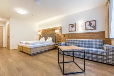 Ein Bett oder Betten in einem Zimmer der Unterkunft OFENTÜRL alpine living