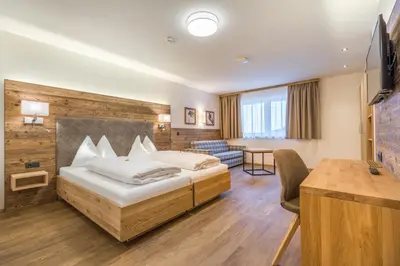 Ein Bett oder Betten in einem Zimmer der Unterkunft OFENTÜRL alpine living