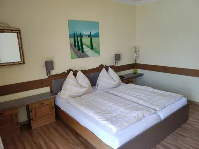 Ein Bett oder Betten in einem Zimmer der Unterkunft B&B Goldener Stern