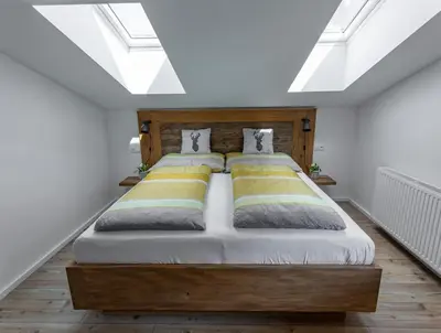 Ein Bett oder Betten in einem Zimmer der Unterkunft Alpenhaus Dachstein.Zauber