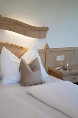 Ein Bett oder Betten in einem Zimmer der Unterkunft Landhotel - Apartments Bauer