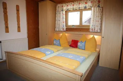 Ein Bett oder Betten in einem Zimmer der Unterkunft Ferienhaus Hintersee