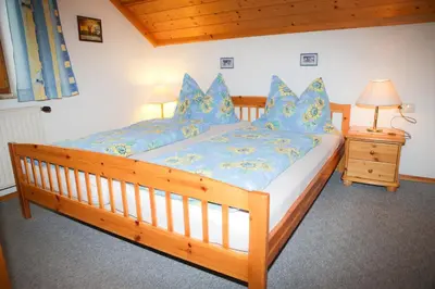 Ein Bett oder Betten in einem Zimmer der Unterkunft Ferienhaus Hintersee