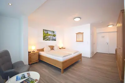 Ein Bett oder Betten in einem Zimmer der Unterkunft Landhotel Post Ebensee am Traunsee ***S