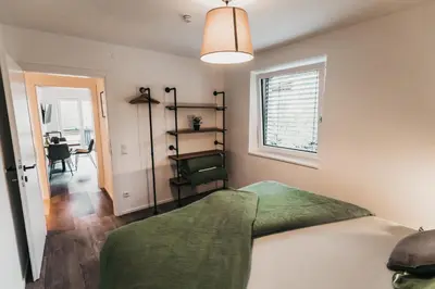 Ein Bett oder Betten in einem Zimmer der Unterkunft Seeblick Homes