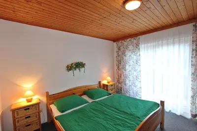 Ein Bett oder Betten in einem Zimmer der Unterkunft Pension Sybille